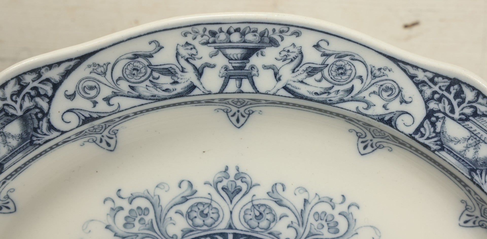 Lot 064 - Vintage Wedgwood Neoclassical Revival Transferware Platter With Griffin Motif, Greco-Roman Architectural Elements, Urns, Circa 1932, 17-1/4" x 13-1/2"