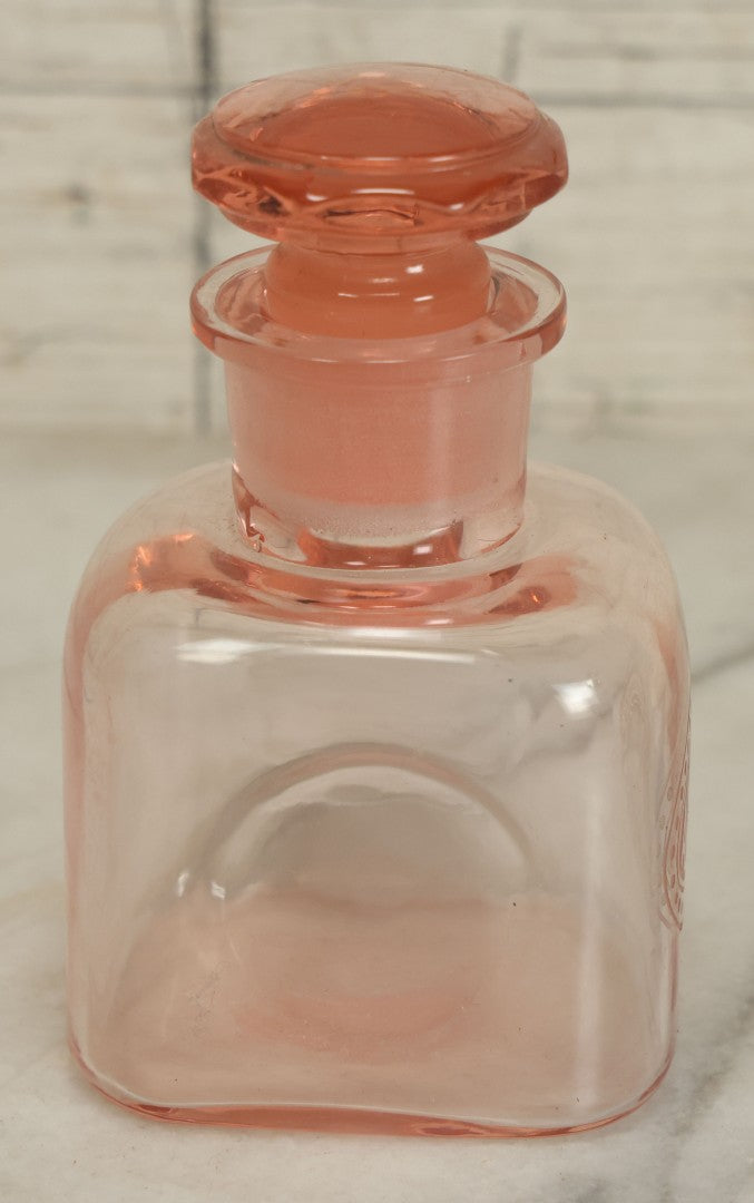 Lot 065 - Pair Of Antique Pink Depression Glass Etched Vanity Bathroom Jars With Stoppers, Alcohol And Mouthwash, 4-3/8" Height Each