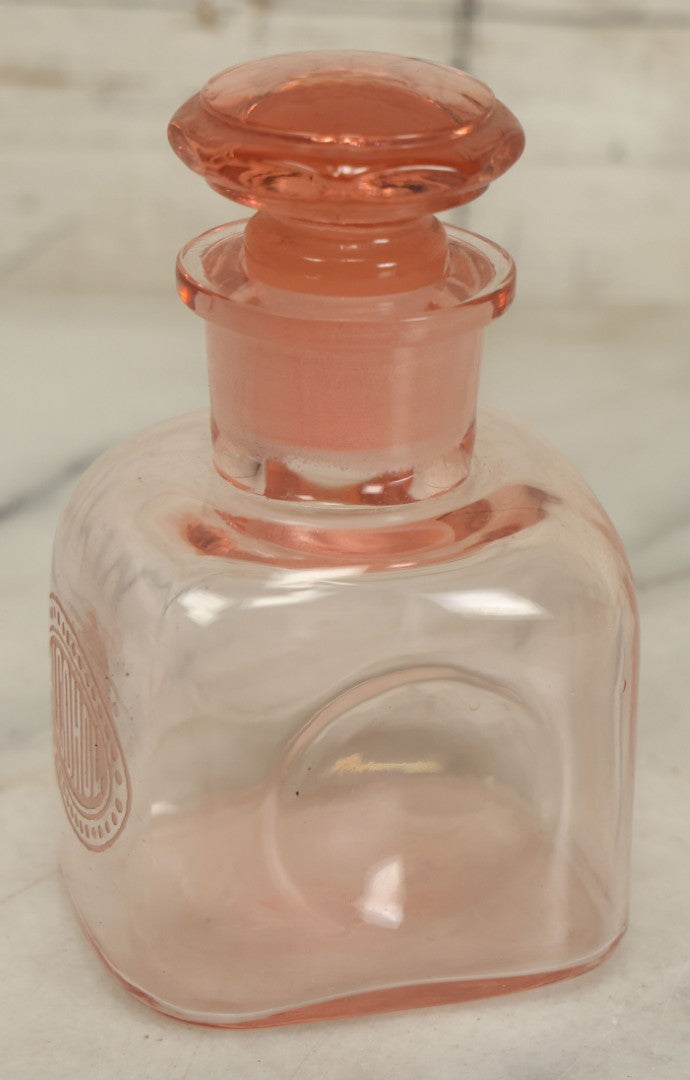 Lot 065 - Pair Of Antique Pink Depression Glass Etched Vanity Bathroom Jars With Stoppers, Alcohol And Mouthwash, 4-3/8" Height Each