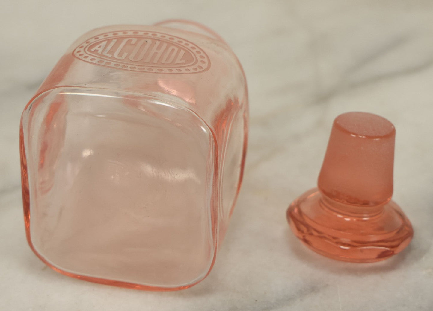 Lot 065 - Pair Of Antique Pink Depression Glass Etched Vanity Bathroom Jars With Stoppers, Alcohol And Mouthwash, 4-3/8" Height Each