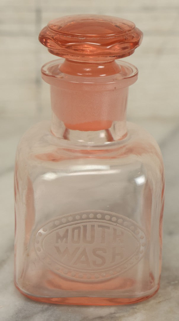 Lot 065 - Pair Of Antique Pink Depression Glass Etched Vanity Bathroom Jars With Stoppers, Alcohol And Mouthwash, 4-3/8" Height Each
