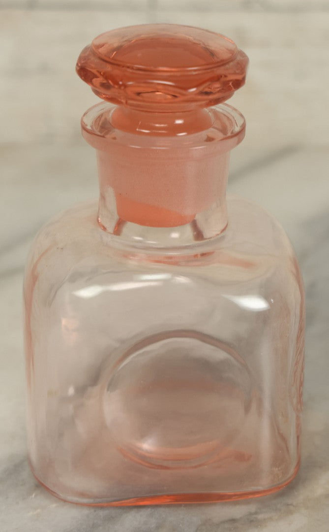 Lot 065 - Pair Of Antique Pink Depression Glass Etched Vanity Bathroom Jars With Stoppers, Alcohol And Mouthwash, 4-3/8" Height Each