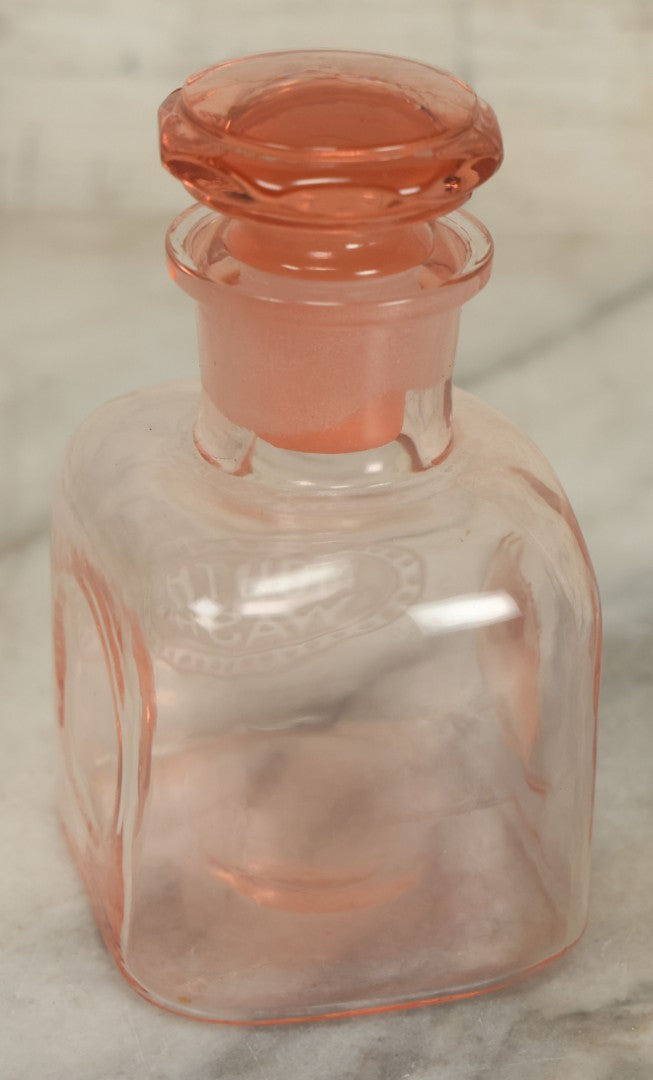 Lot 065 - Pair Of Antique Pink Depression Glass Etched Vanity Bathroom Jars With Stoppers, Alcohol And Mouthwash, 4-3/8" Height Each