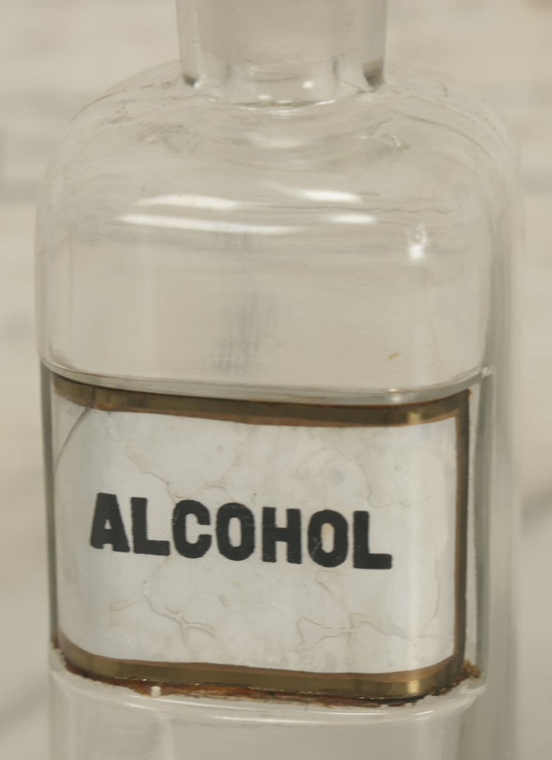 Lot 066 - Antique Whitall And Tatum Co. Glass Alcohol Apothecary Bottle Jar With Reverse Painted Glass Label, Note Chip To Lip Of Bottle, Crack In Label, 7" Height