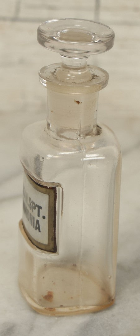 Lot 068 - Antique Glass Aromatic Spirit Of Ammonia (Arom. Spt. Ammonia) Apothecary Bottle With Reverse Painted Glass Label, Patented April 2, 1889, 4-1/2" Height
