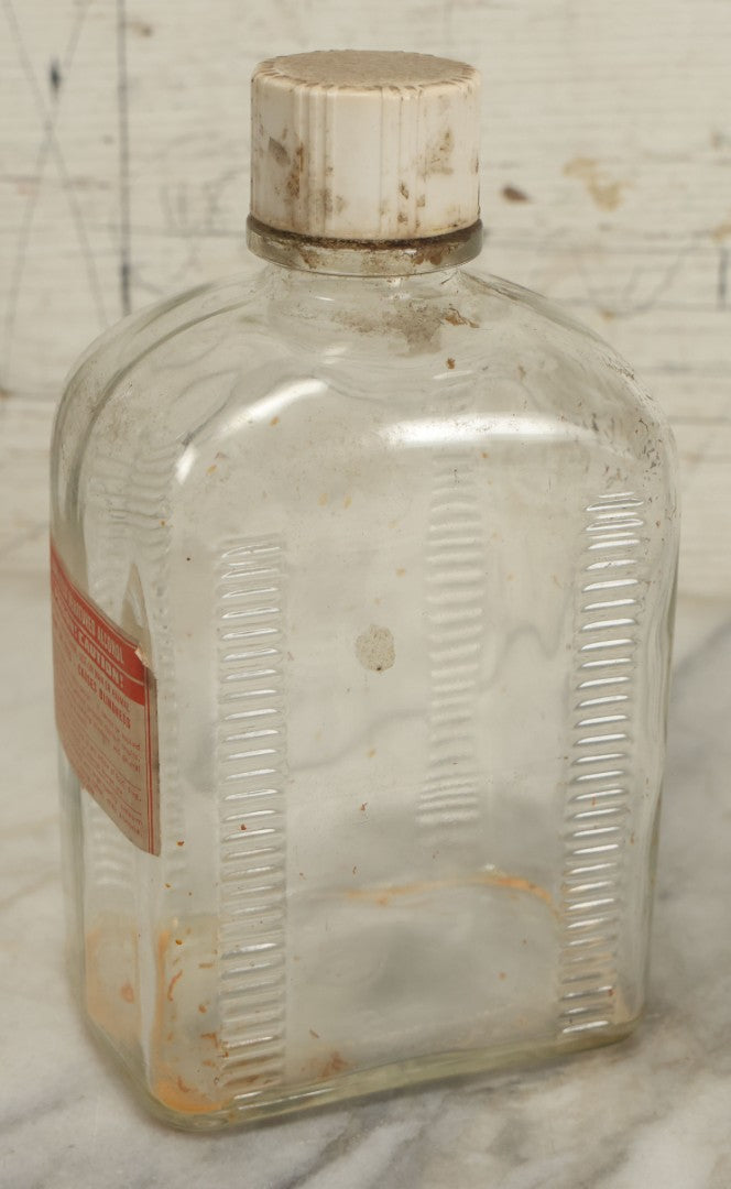 Lot 069 - Vintage Glass Pharmacy Jar Jug Bottle With Applied Paper Label, Completely Denatured Alcohol, Poison: Caution! With Skull And Crossbones, 7-5/8" Height