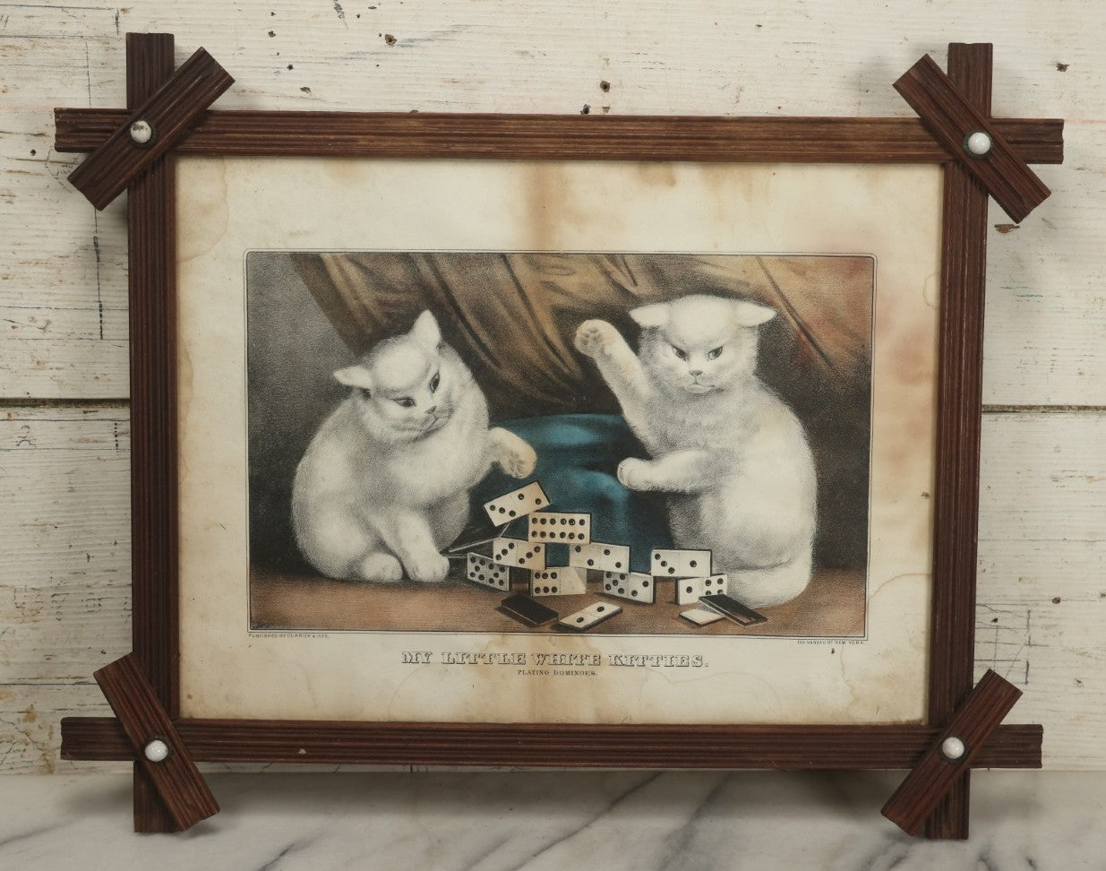 Lot 070 - "My Little White Kitties, Playing Dominoes" Antique Hand Colored Lithograph Published By Currier & Ives, In Original Period Frame With Mil Glass Adornments, Note Water Damage, Foxing, Warping, Overall Dimensions 20-3/8" x 16-3/8"
