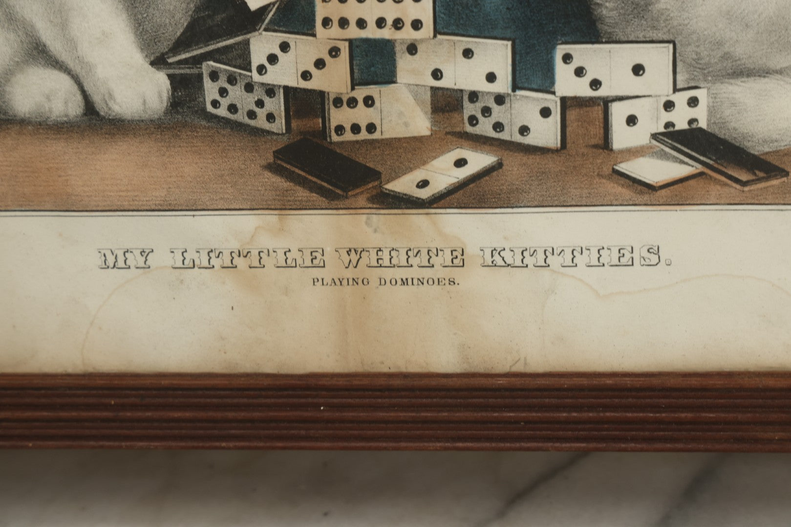 Lot 070 - "My Little White Kitties, Playing Dominoes" Antique Hand Colored Lithograph Published By Currier & Ives, In Original Period Frame With Mil Glass Adornments, Note Water Damage, Foxing, Warping, Overall Dimensions 20-3/8" x 16-3/8"