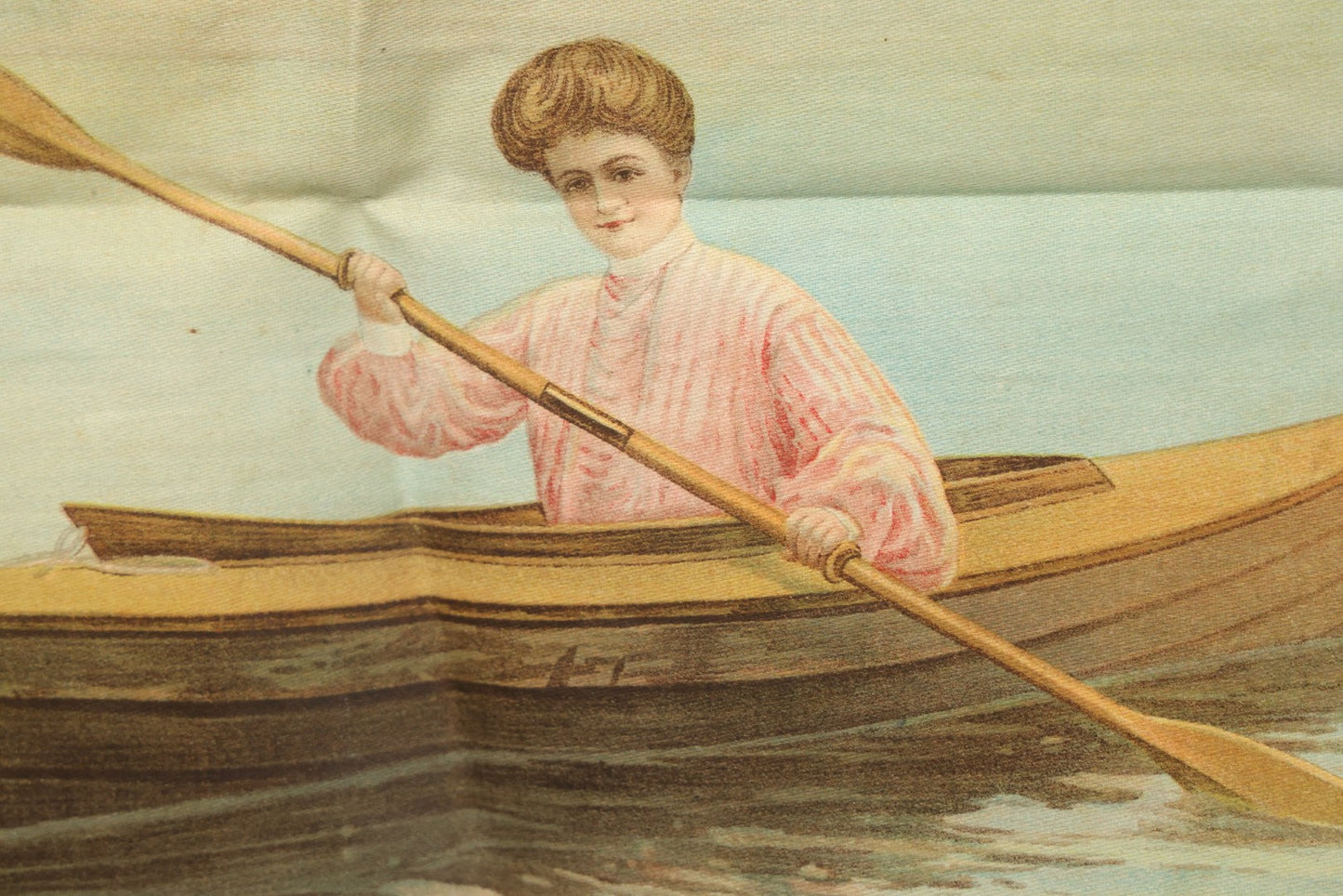 Lot 004 - Antique Lithograph On Linen Of A Woman Canoeing, Copyright 1904, 22-3/4" x 23"
