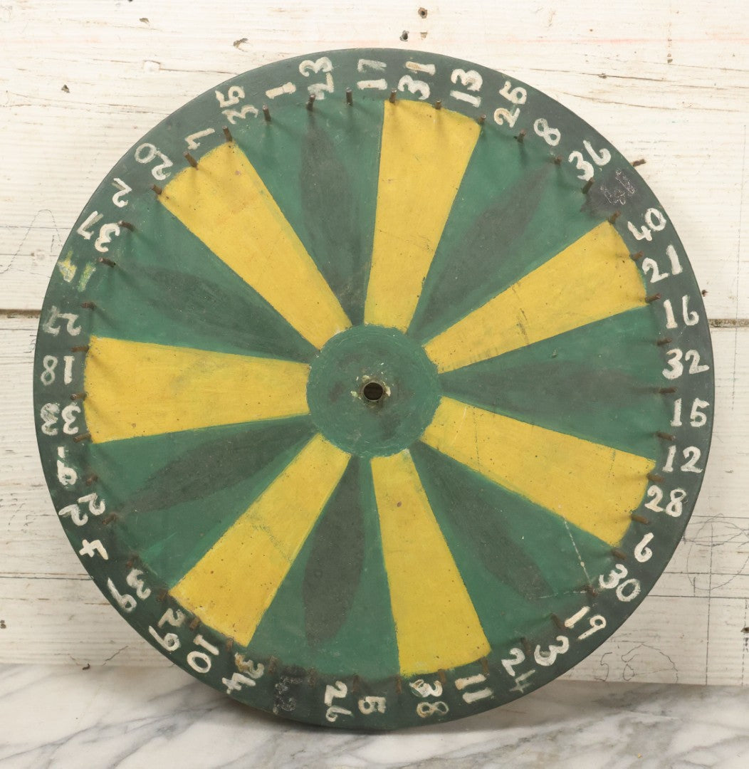 Lot 022 - Vintage Folk Art Carnival Spinning Game Wheel In Yellow, Black, And Green Paint, Hand Painted, As Found, 14-3/4" Diameter