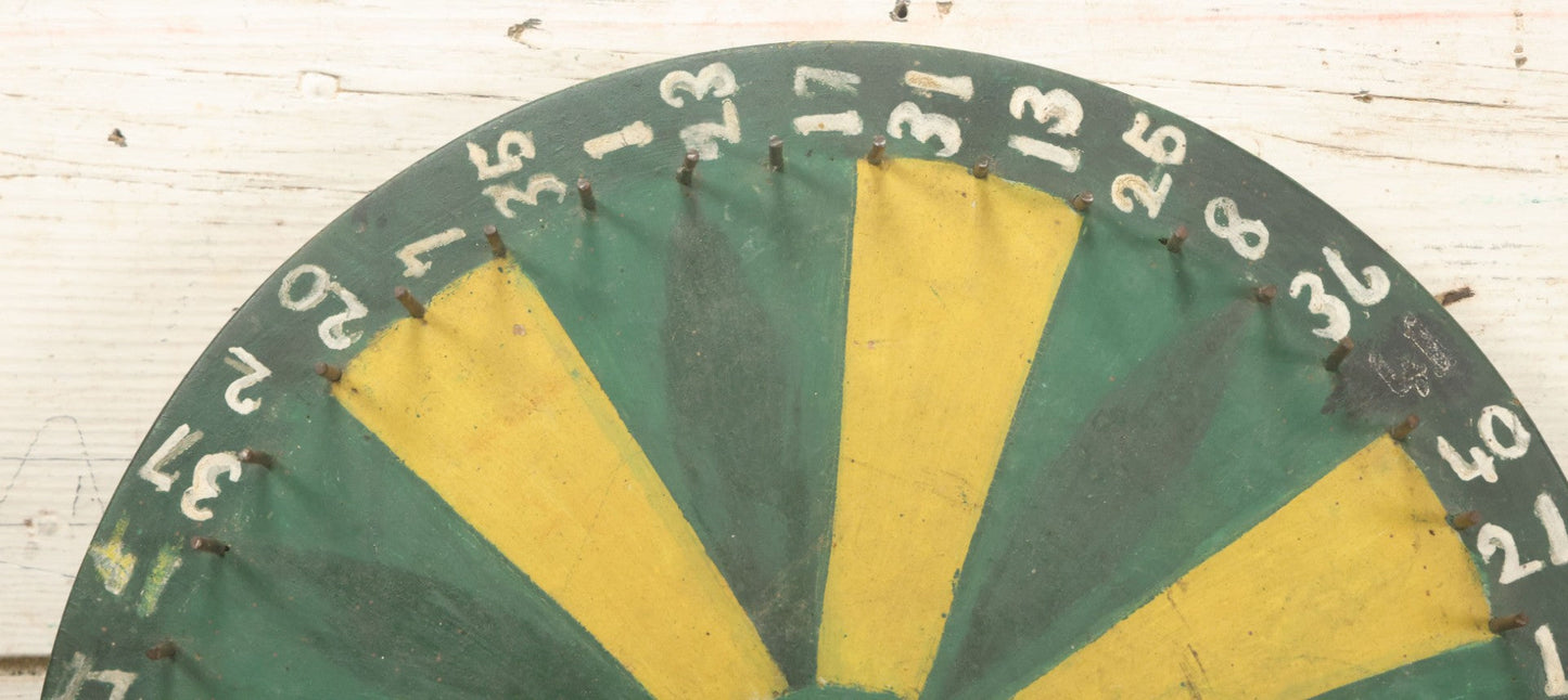 Lot 022 - Vintage Folk Art Carnival Spinning Game Wheel In Yellow, Black, And Green Paint, Hand Painted, As Found, 14-3/4" Diameter