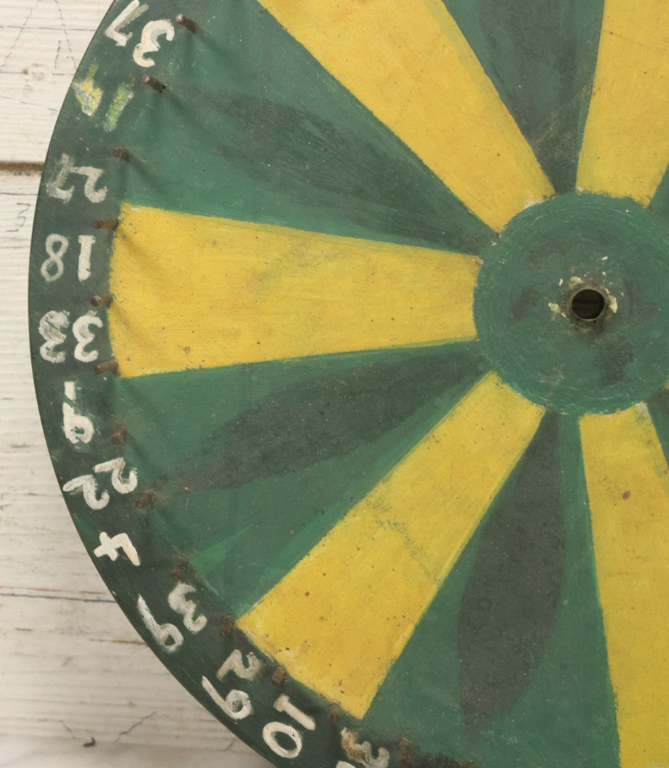 Lot 022 - Vintage Folk Art Carnival Spinning Game Wheel In Yellow, Black, And Green Paint, Hand Painted, As Found, 14-3/4" Diameter