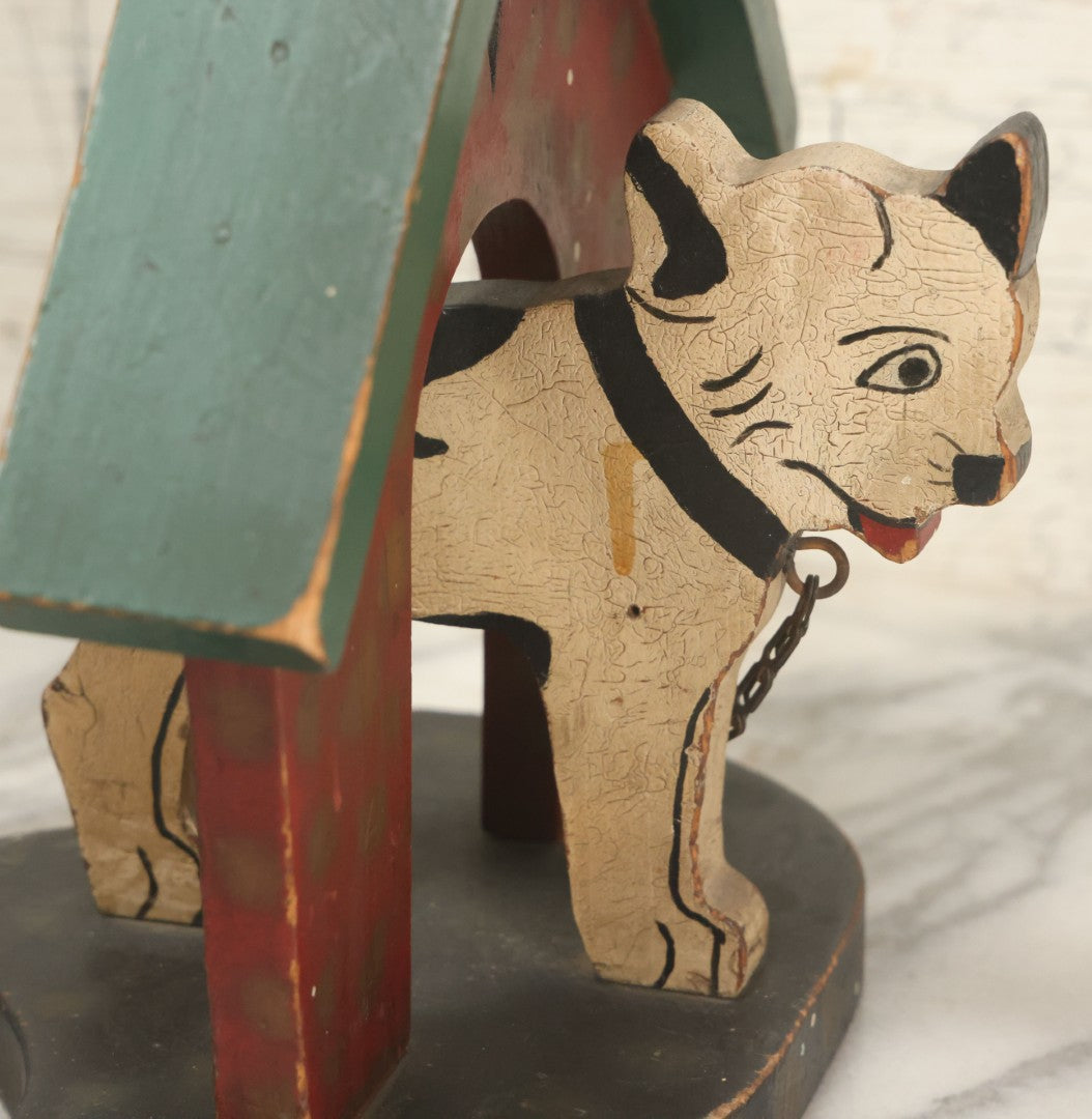 Lot 023 - Vintage Folk Art Boston Terrier Hand Painted, Hand Cut Wooden Door Stop With Red House, Green Roof, Star Cutout