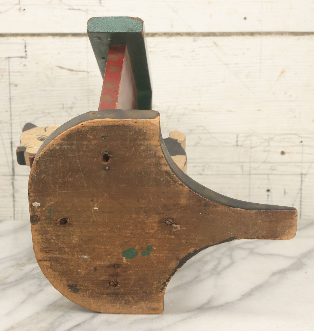 Lot 023 - Vintage Folk Art Boston Terrier Hand Painted, Hand Cut Wooden Door Stop With Red House, Green Roof, Star Cutout