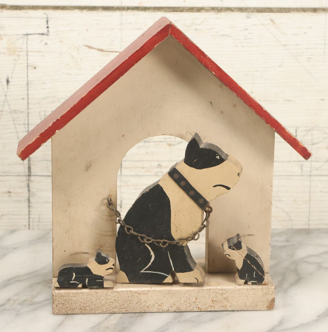 Lot 024 - Vintage Folk Art Boston Terrier Hand Painted, Hand Cut Wooden Door Stop With White House, Red Roof, Dog With Two Puppies