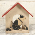Lot 024 - Vintage Folk Art Boston Terrier Hand Painted, Hand Cut Wooden Door Stop With White House, Red Roof, Dog With Two Puppies