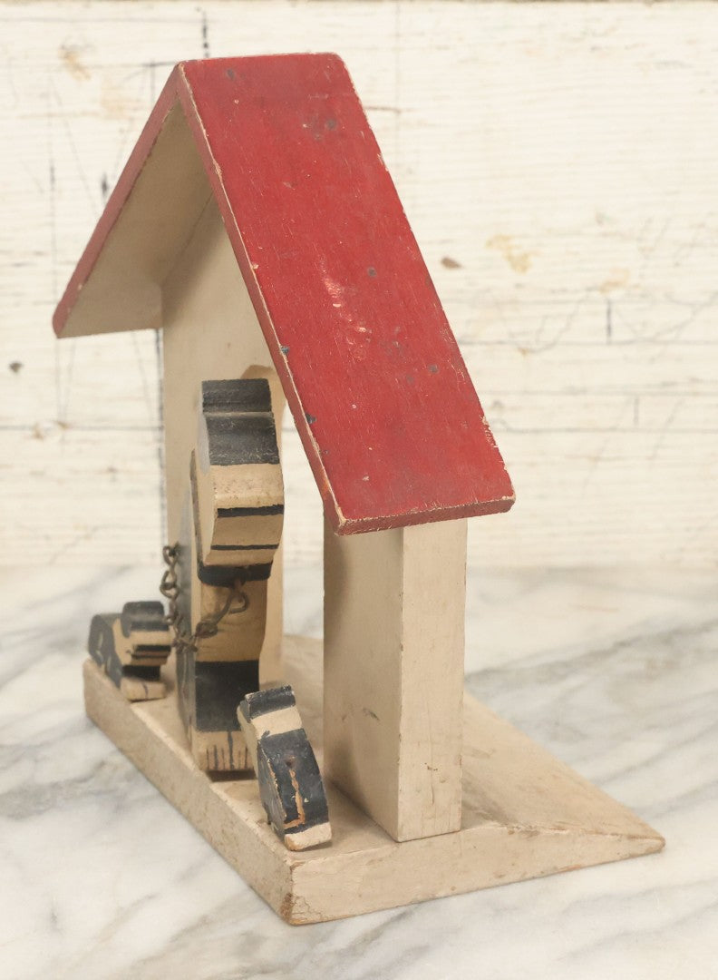 Lot 024 - Vintage Folk Art Boston Terrier Hand Painted, Hand Cut Wooden Door Stop With White House, Red Roof, Dog With Two Puppies