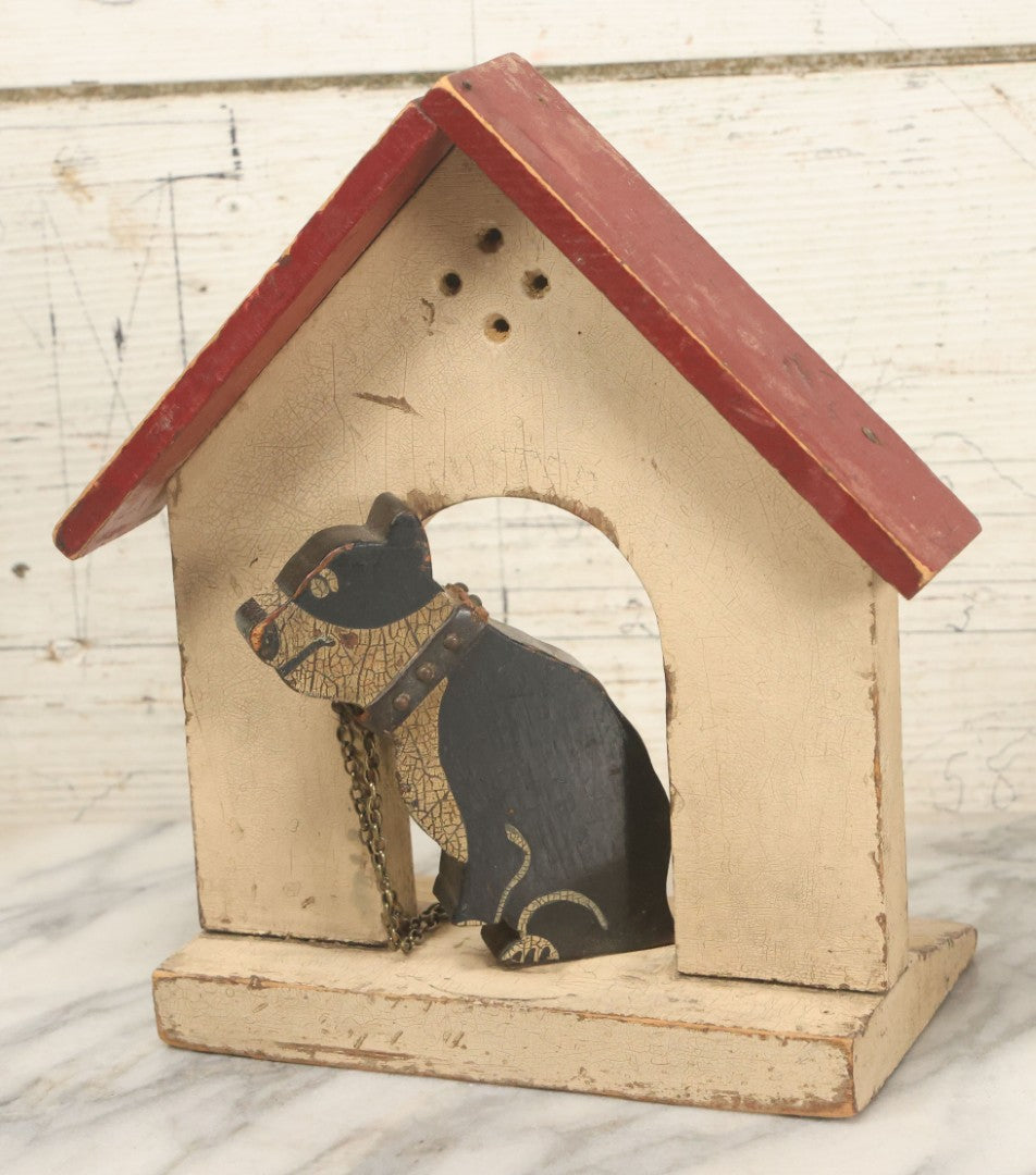 Lot 025 - Vintage Folk Art Boston Terrier Hand Painted, Hand Cut Wooden Door Stop With White House, Red Roof, Single Dog With Collar And Chain, Note Damaged Foot