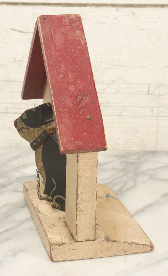 Lot 025 - Vintage Folk Art Boston Terrier Hand Painted, Hand Cut Wooden Door Stop With White House, Red Roof, Single Dog With Collar And Chain, Note Damaged Foot