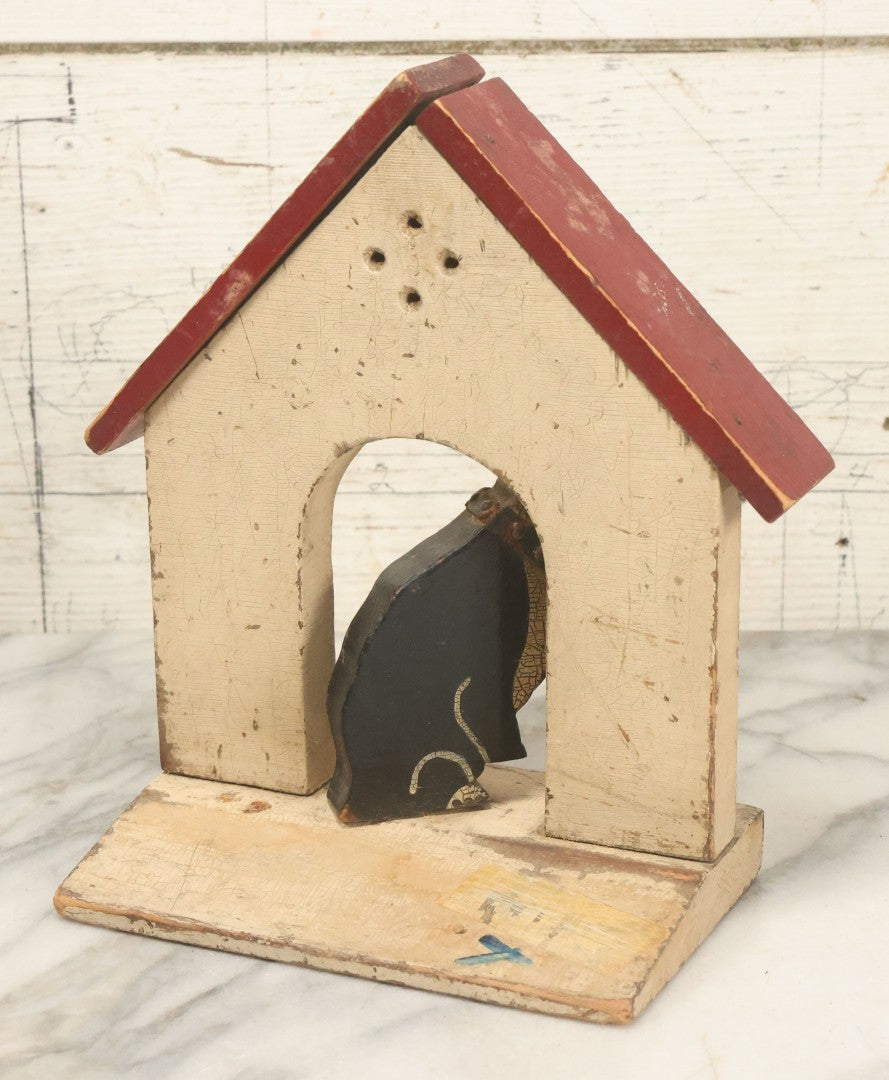 Lot 025 - Vintage Folk Art Boston Terrier Hand Painted, Hand Cut Wooden Door Stop With White House, Red Roof, Single Dog With Collar And Chain, Note Damaged Foot