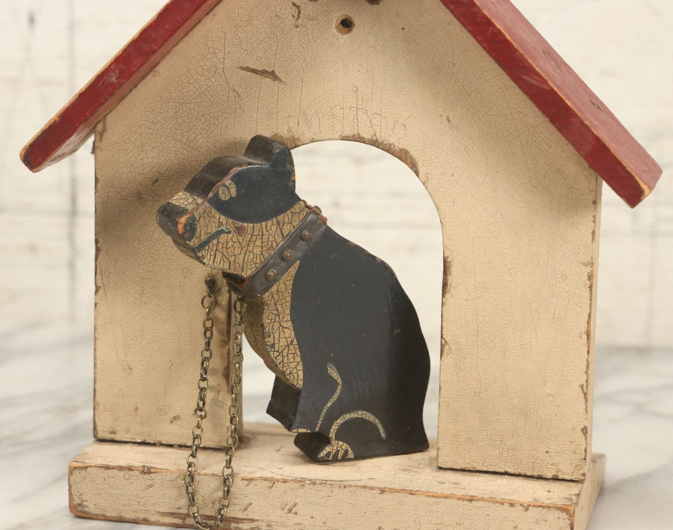 Lot 025 - Vintage Folk Art Boston Terrier Hand Painted, Hand Cut Wooden Door Stop With White House, Red Roof, Single Dog With Collar And Chain, Note Damaged Foot