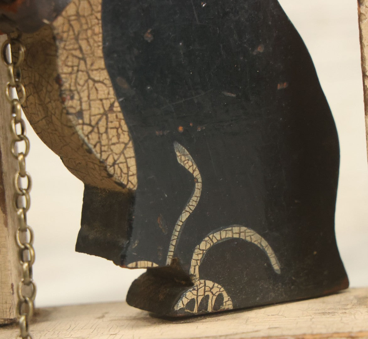 Lot 025 - Vintage Folk Art Boston Terrier Hand Painted, Hand Cut Wooden Door Stop With White House, Red Roof, Single Dog With Collar And Chain, Note Damaged Foot