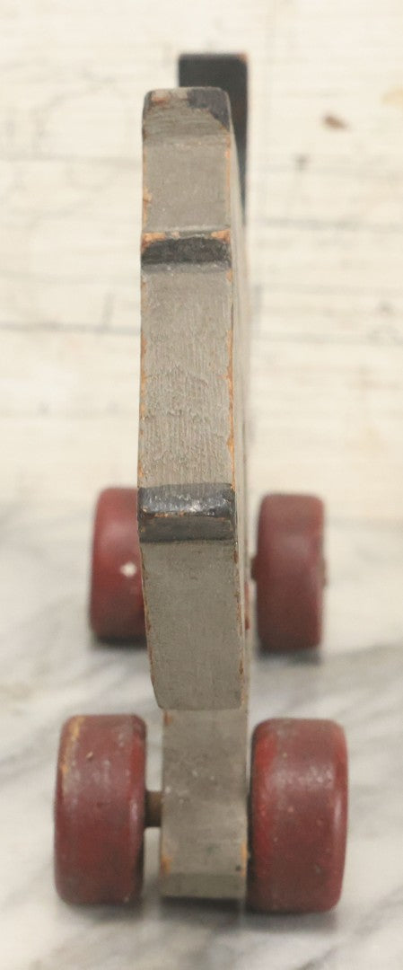 Lot 027 - Vintage Folk Art Hand Painted, Hand Cut Wooden Scottie Dog Rolling Toy