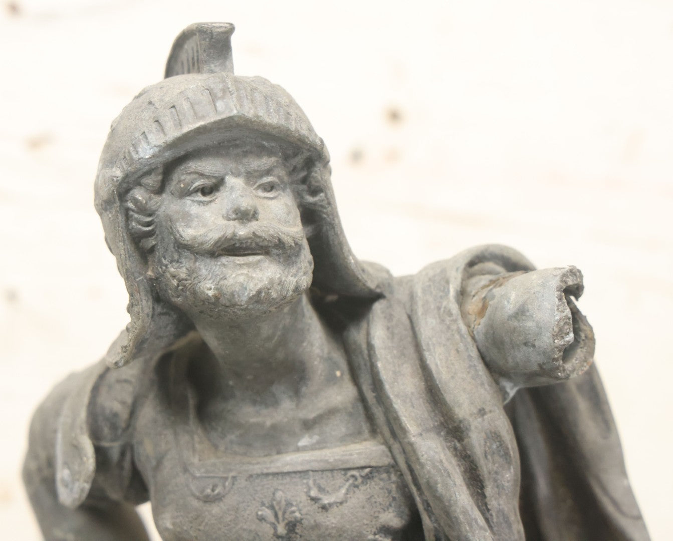 Lot 035 - Antique Spelter Metal Soldier Statue, Wearing Armor And Helmet, Note Missing Arm, Damaged / Warped Based, Overall Poor Condition, 16-1/2" Height