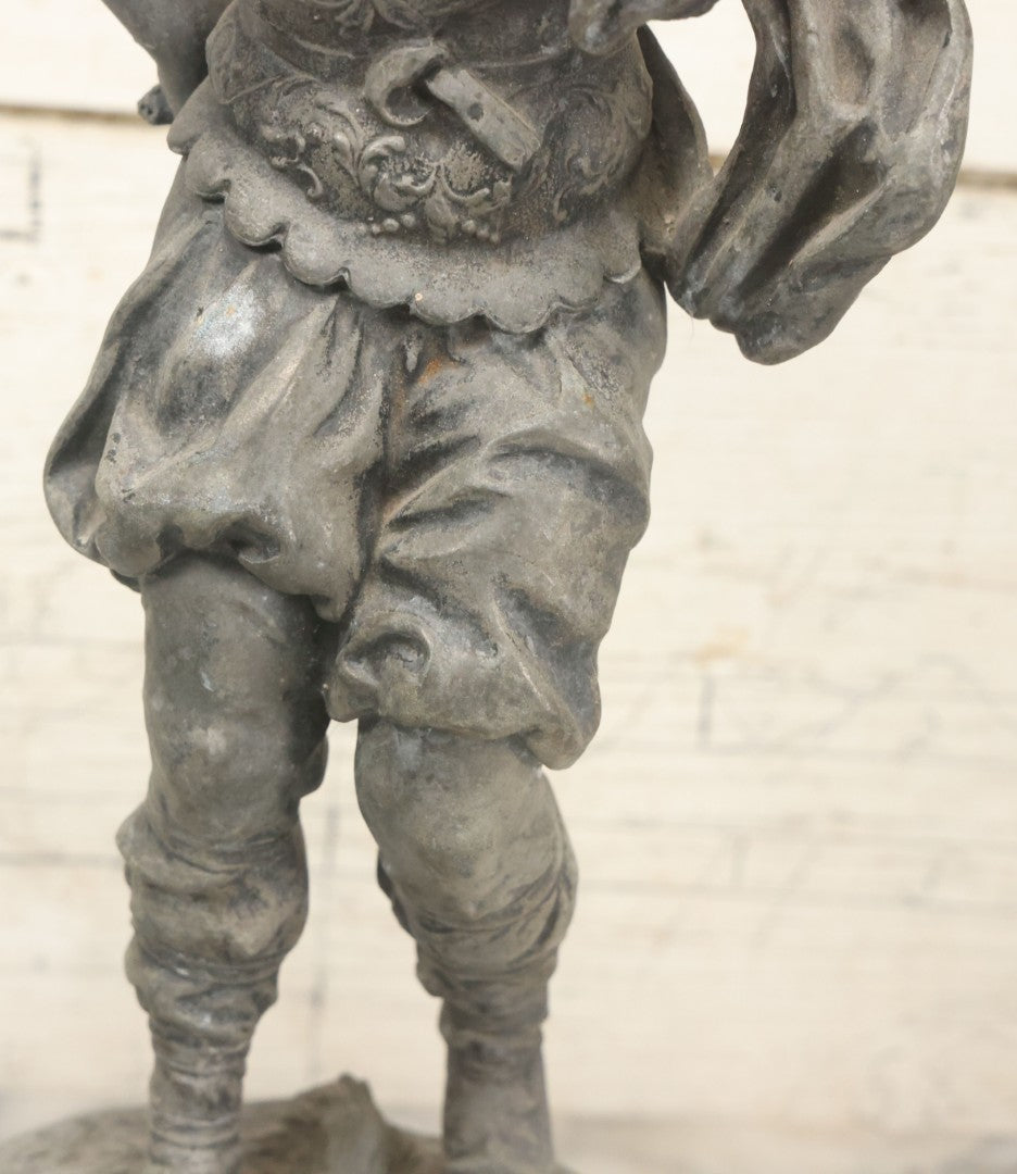 Lot 035 - Antique Spelter Metal Soldier Statue, Wearing Armor And Helmet, Note Missing Arm, Damaged / Warped Based, Overall Poor Condition, 16-1/2" Height