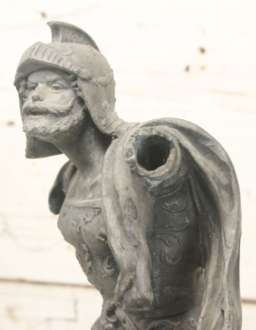 Lot 035 - Antique Spelter Metal Soldier Statue, Wearing Armor And Helmet, Note Missing Arm, Damaged / Warped Based, Overall Poor Condition, 16-1/2" Height