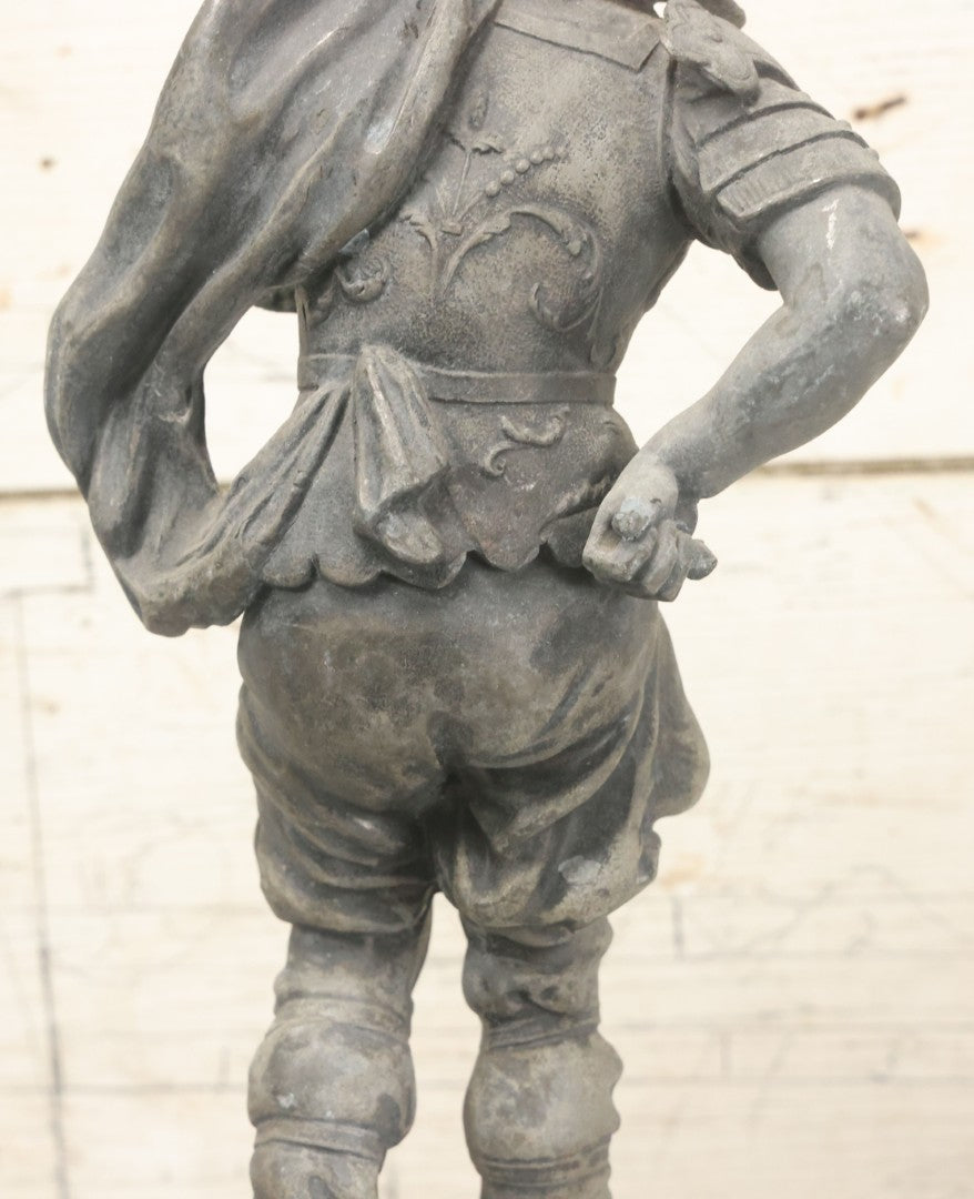 Lot 035 - Antique Spelter Metal Soldier Statue, Wearing Armor And Helmet, Note Missing Arm, Damaged / Warped Based, Overall Poor Condition, 16-1/2" Height