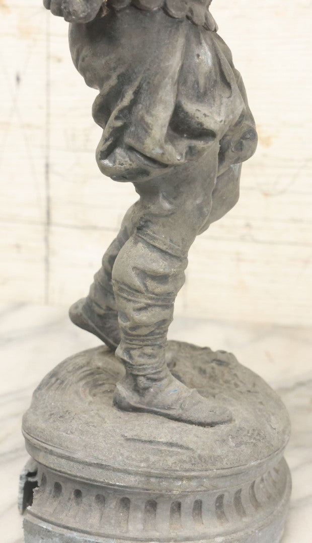 Lot 035 - Antique Spelter Metal Soldier Statue, Wearing Armor And Helmet, Note Missing Arm, Damaged / Warped Based, Overall Poor Condition, 16-1/2" Height