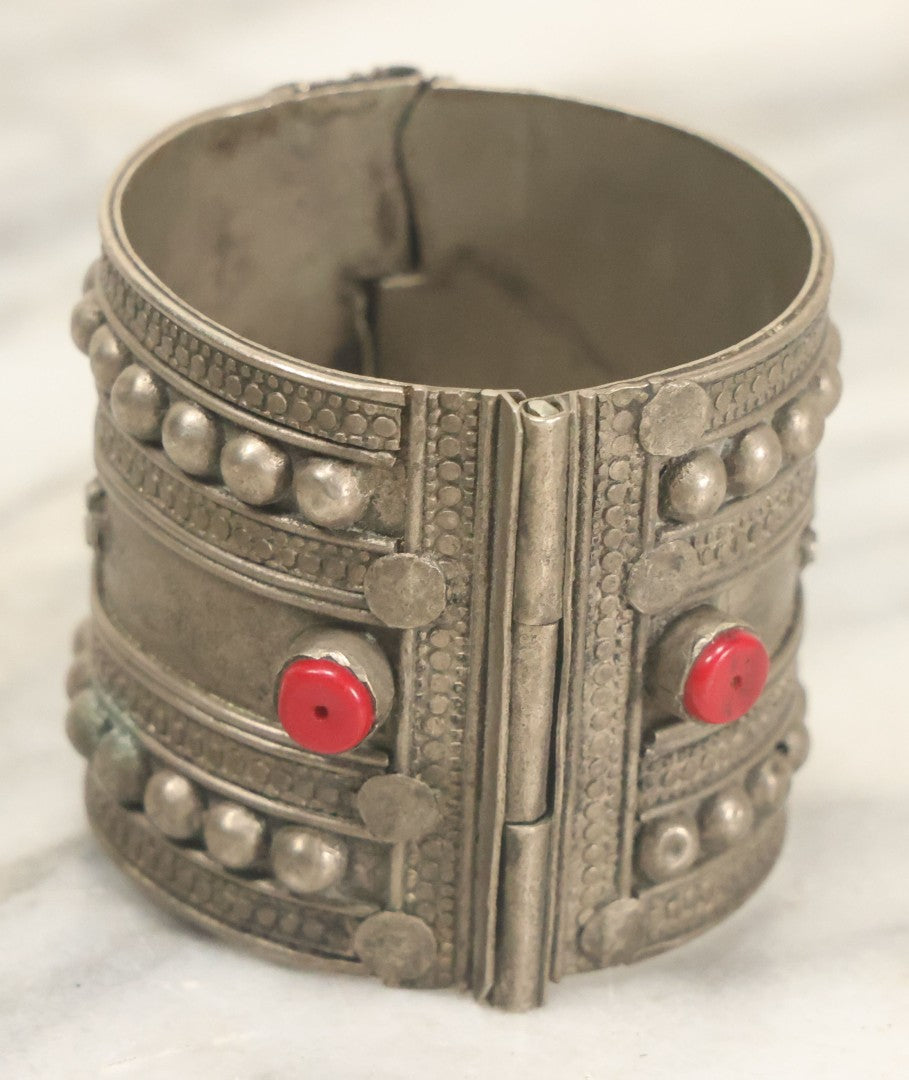 Lot 038 - Pair Of Ornate Middle Eastern Metal Cuff Bracelets, One With Red Beads
