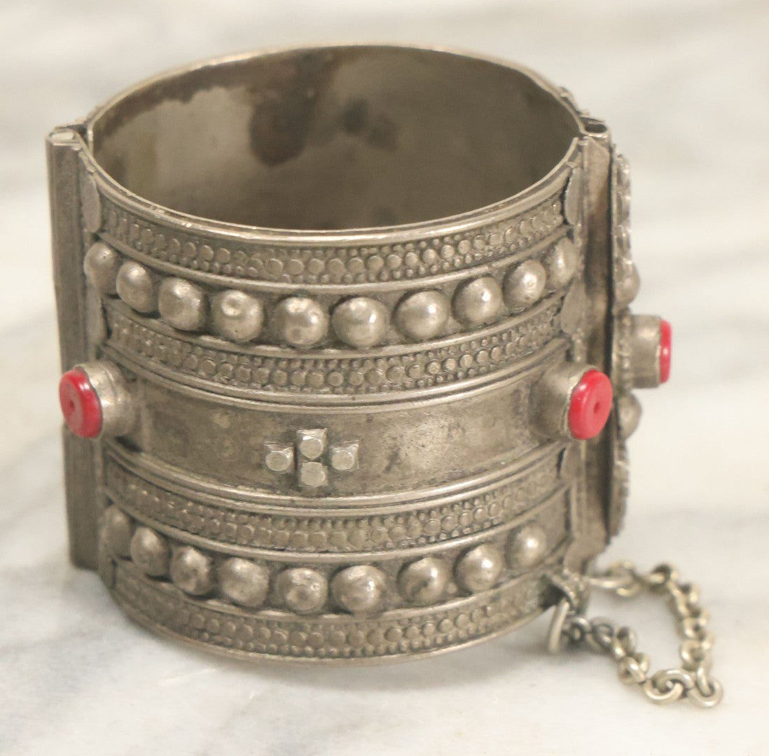 Lot 038 - Pair Of Ornate Middle Eastern Metal Cuff Bracelets, One With Red Beads