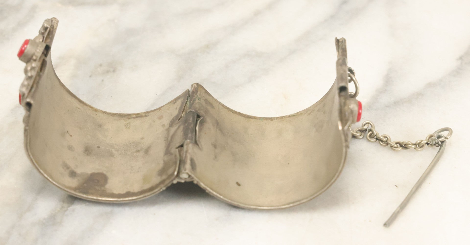 Lot 038 - Pair Of Ornate Middle Eastern Metal Cuff Bracelets, One With Red Beads