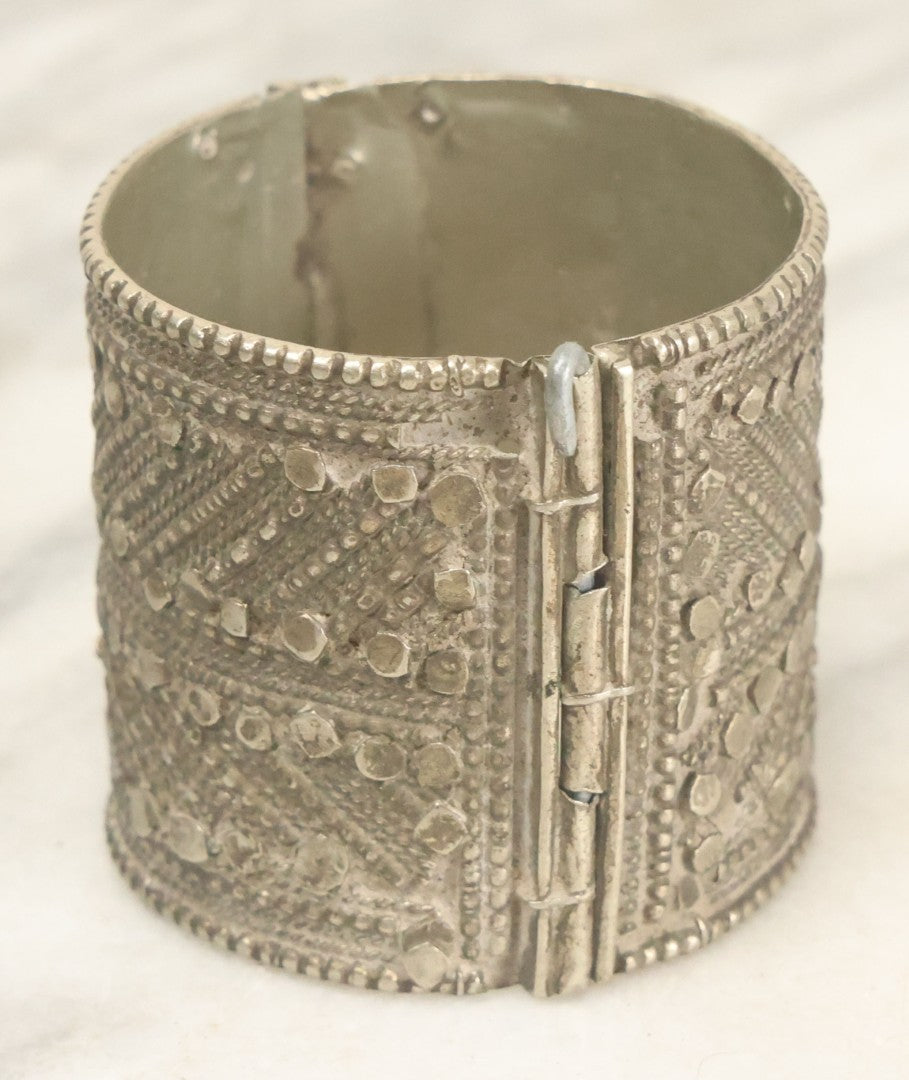 Lot 038 - Pair Of Ornate Middle Eastern Metal Cuff Bracelets, One With Red Beads