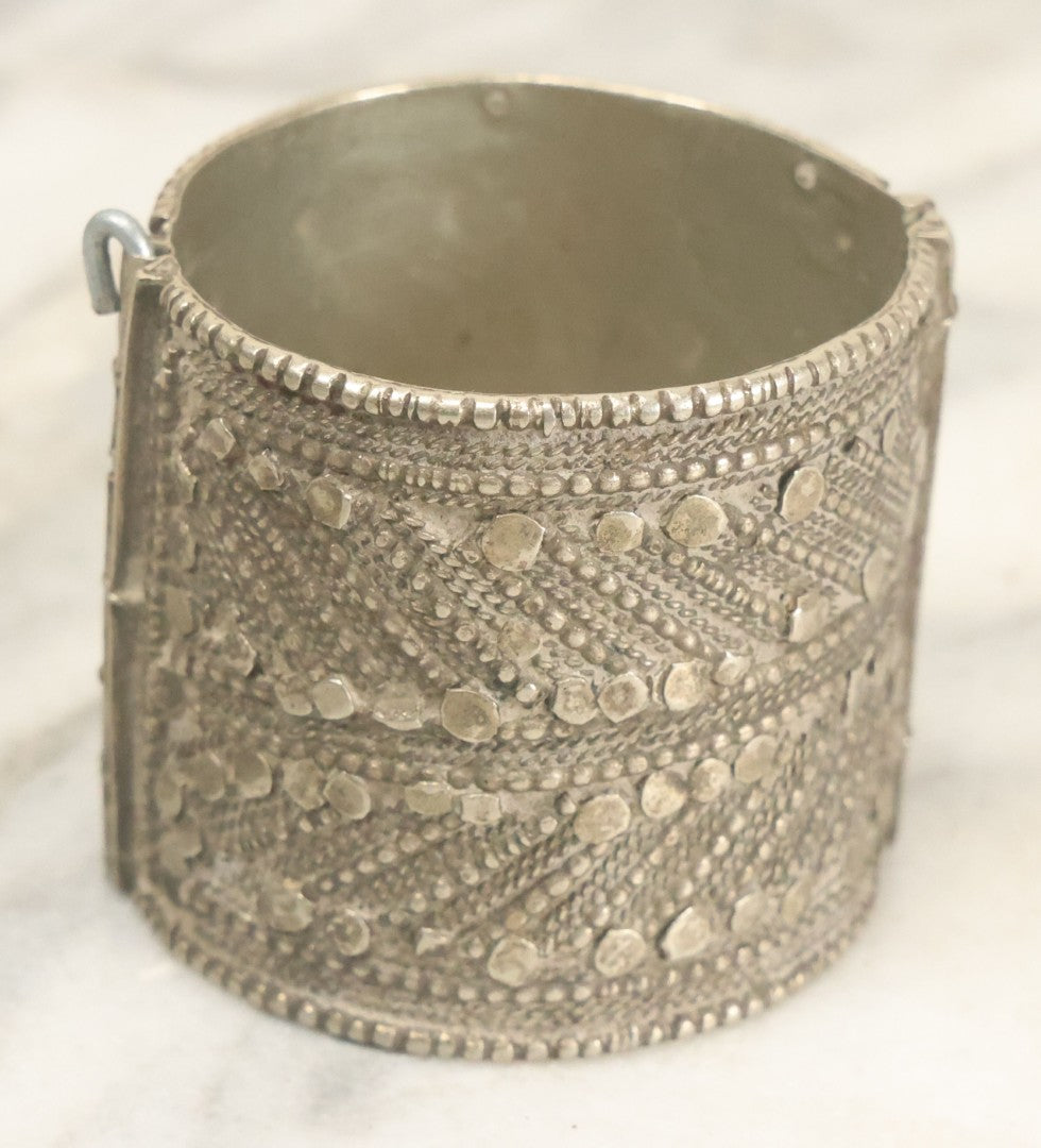 Lot 038 - Pair Of Ornate Middle Eastern Metal Cuff Bracelets, One With Red Beads