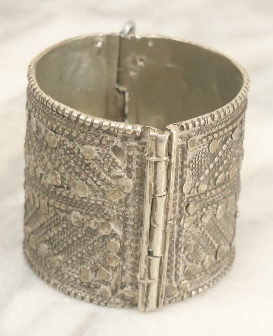 Lot 038 - Pair Of Ornate Middle Eastern Metal Cuff Bracelets, One With Red Beads