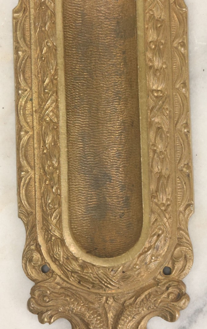 Lot 039 - Vintage Solid Brass Pocket Door Pull With Dolphin Motif, Ornate Design