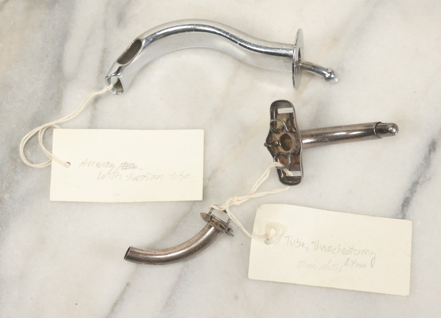 Lot 049 - Grouping Of Three Vintage Tracheotomy Medical Devices, With Paper Identification Tags