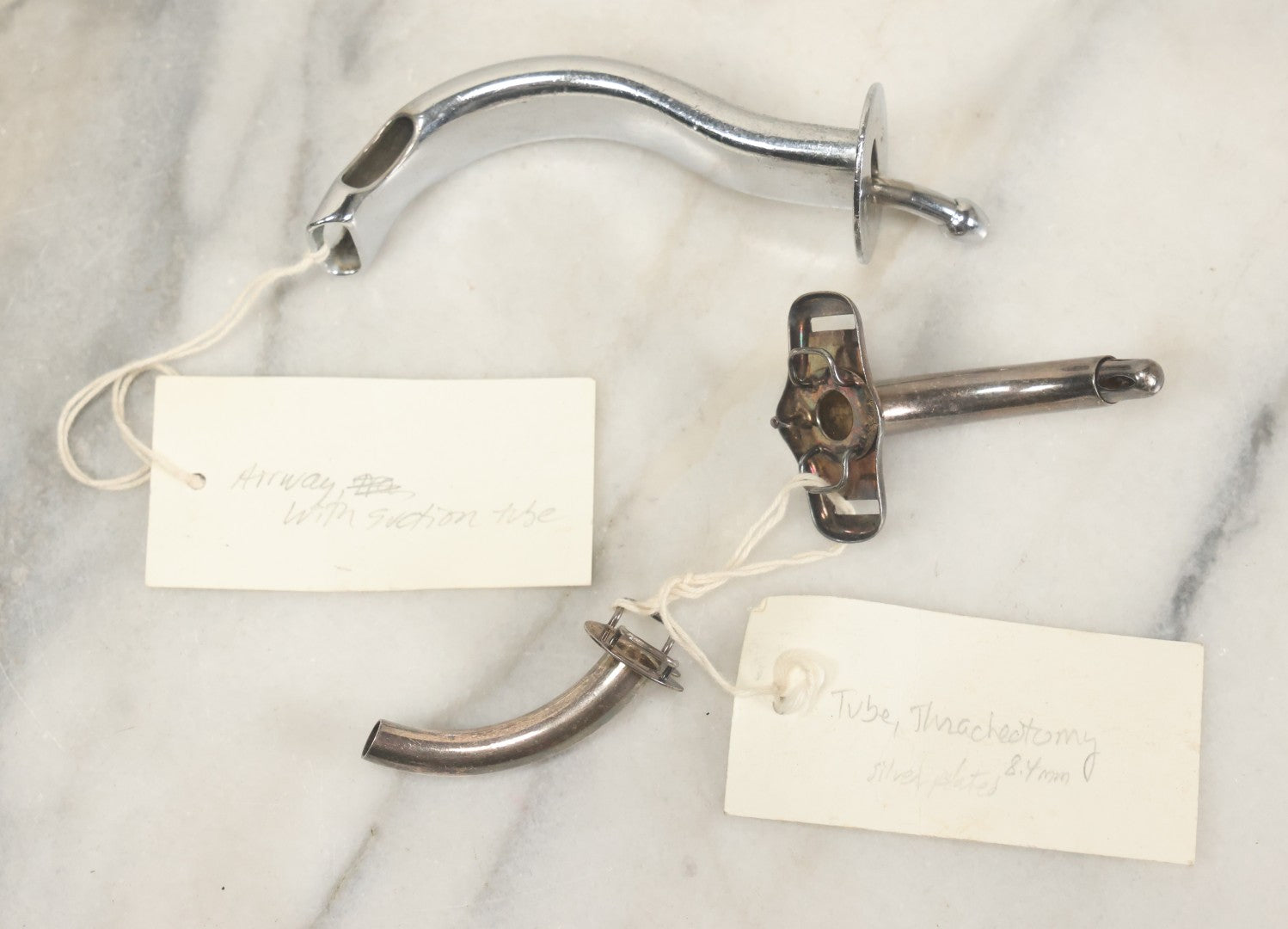 Lot 049 - Grouping Of Three Vintage Tracheotomy Medical Devices, With Paper Identification Tags