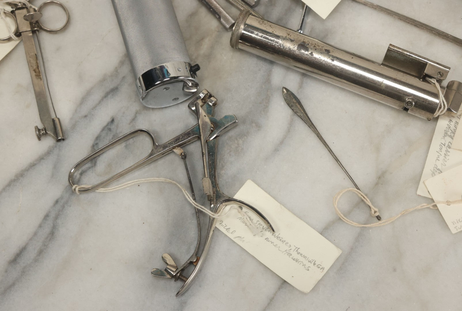 Lot 051 - Grouping Of Ten Vintage Medical Devices, Including Spection Devices, Irrigation Syringe, Etc., With Paper Identification Tags