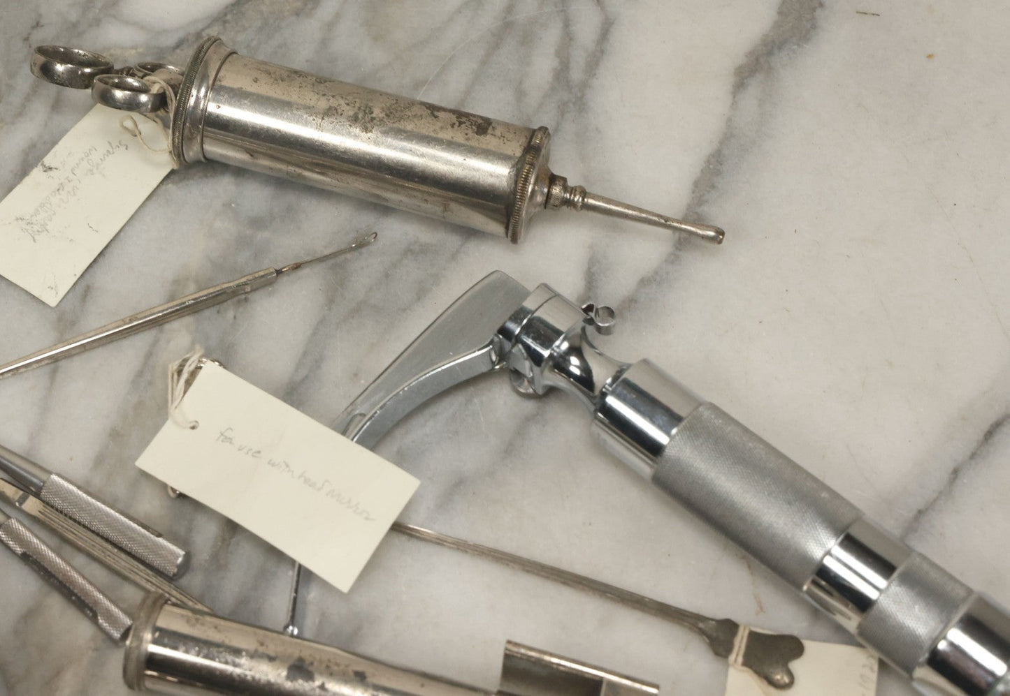 Lot 051 - Grouping Of Ten Vintage Medical Devices, Including Spection Devices, Irrigation Syringe, Etc., With Paper Identification Tags