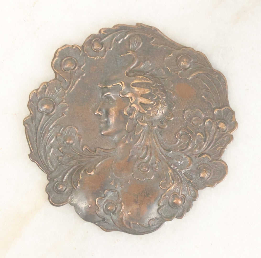 Lot 076 - Antique Art Nouveau Metal Medallion With Woman In Elaborate Peacock Or Swan Headdress, As Found