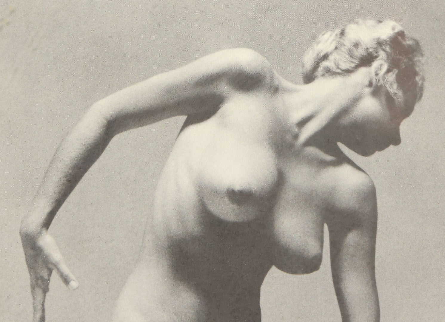 Lot 090 - Vintage Artistic Nude Photograph Magazine Clipping Of A Woman Posing On Rocks, After Andres De Dienes, 8-3/4" x 11-1/8"