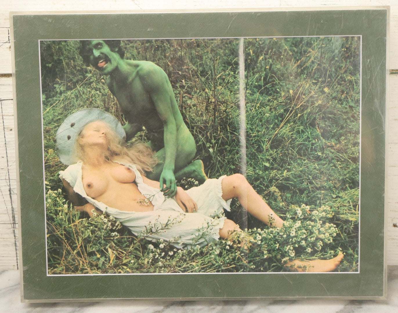 Lot 091 - Vintage Bizarre Nude Photograph With Man In Green Paint, Nude Woman, Magazine Clipping In Modern Frame, 14-1/4" x 11-1/4"