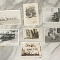 Lot 098 - Grouping Of Seven Vintage Snap Shot Photographs Including Child With Baby Deer Fawn, Man With Pelts, Teepee Campsite, Burned Boat, Etc.