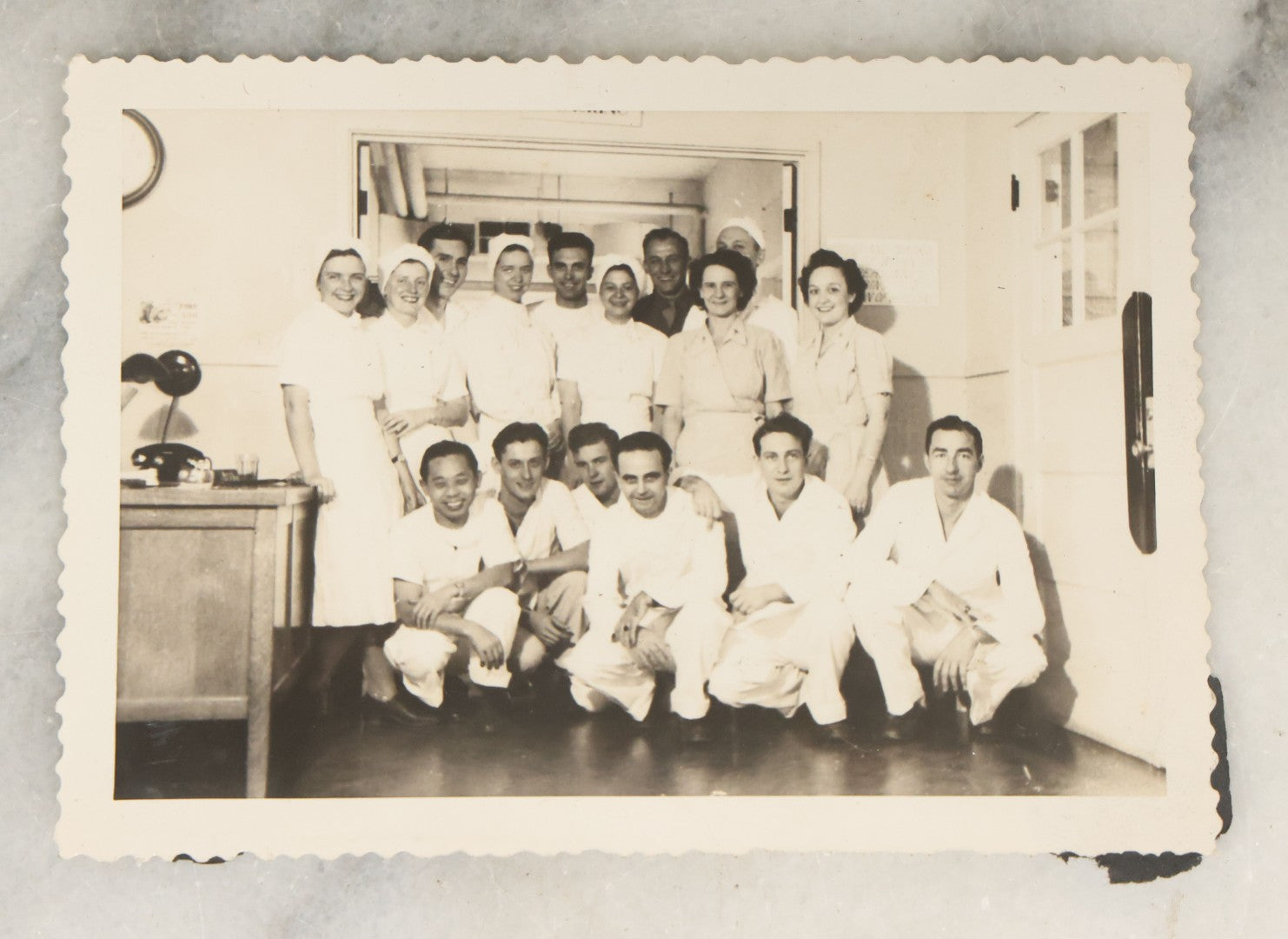 Lot 098 - Grouping Of Seven Vintage Snap Shot Photographs Including Child With Baby Deer Fawn, Man With Pelts, Teepee Campsite, Burned Boat, Etc.