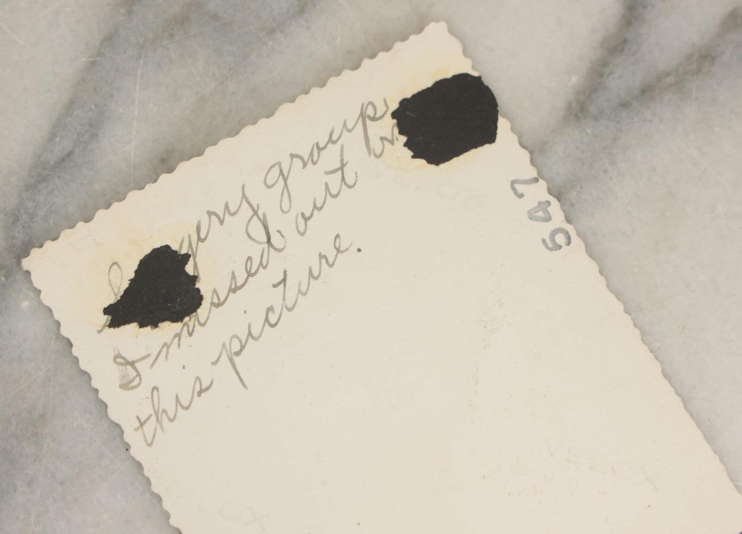 Lot 098 - Grouping Of Seven Vintage Snap Shot Photographs Including Child With Baby Deer Fawn, Man With Pelts, Teepee Campsite, Burned Boat, Etc.