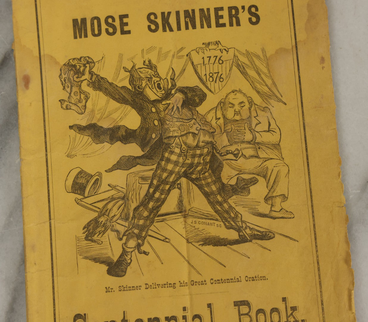Lot 102 - "Mos Skinner's Centennial Book 1776-1876" Antique Comic Illustrated Booklet, Published By New England News Company, Printed By Warren Richardson, Boston, Copyrighted 1875 By J.E. Brown
